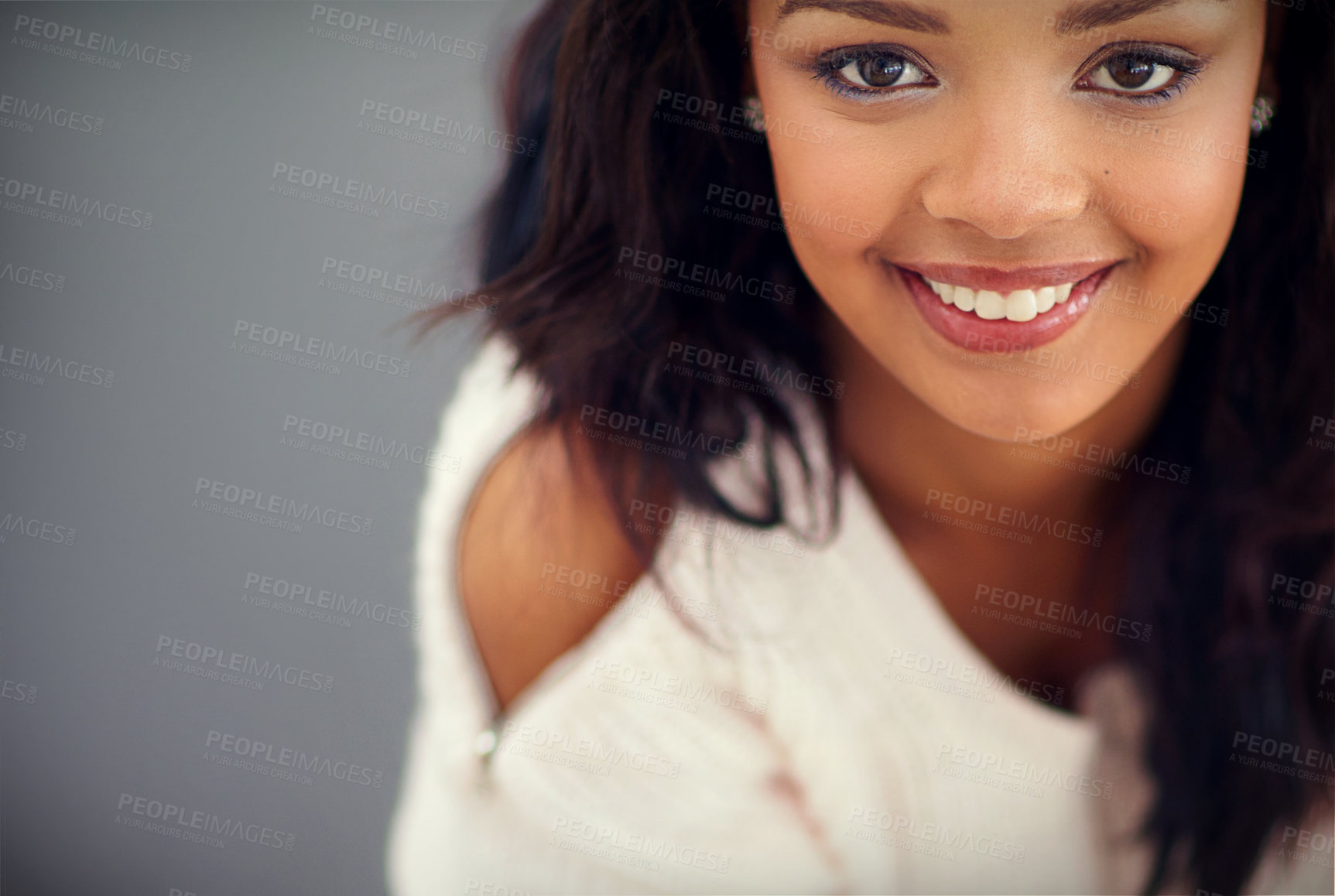 Buy stock photo Black girl, portrait and smile in studio for beauty or fashion with cosmetics, clothes and modern or trendy winter style. African woman, isolated and grey background with mockup, glow and aesthetics.