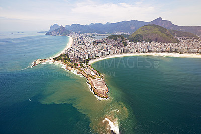 Buy stock photo Aerial view, ocean and buildings in city, travel and architecture in Brazil, tourism and destination. Morning, above and outdoorl in Rio De Janeiro, water and explore in vacation and mountain in sea