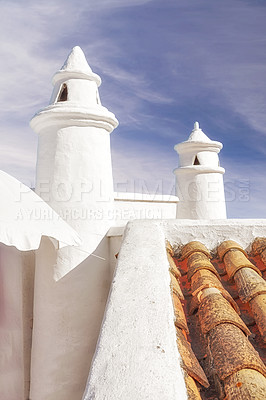 Buy stock photo Building, roof and tiles with chimney, architecture and blue sky for ventilation with aesthetic. Culture, heritage and terracotta with sustainability, insulation or eco friendly clay rooftop in Spain