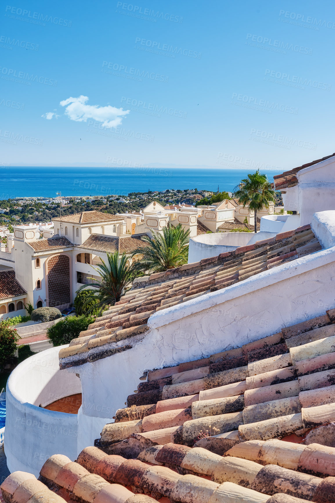 Buy stock photo Building, rooftop and tiles with landscape, architecture and blue sky for travel with aesthetic. Culture, heritage and terracotta with sustainability, insulation or eco friendly clay roof in Spain