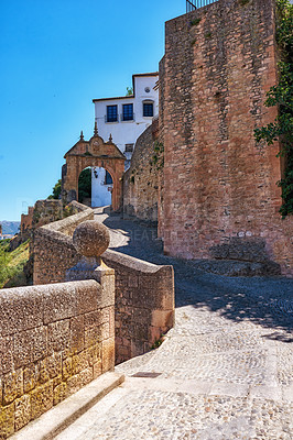 Buy stock photo Architecture, ancient and path in city of Spain for tourism, adventure and travel destination. Background, road and vintage, old and street in town for culture, design and traditional infrastructure