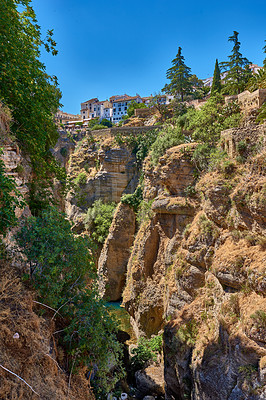 Buy stock photo Nature, landscape and buildings on mountain in Spain for environment, travel and scenic destination. Natural background, tourism and architecture on cliff for countryside, adventure and terrain