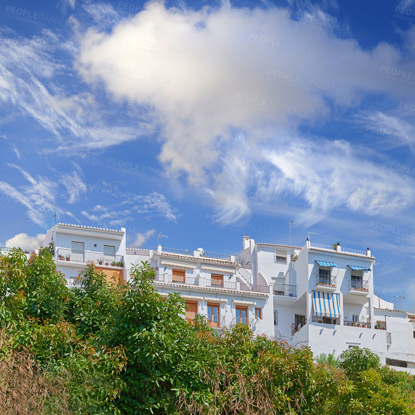 Buy stock photo Architecture, building and house in city of Spain for tourism, adventure and travel destination. Background, blue sky and aesthetic property town for culture, design and traditional infrastructure