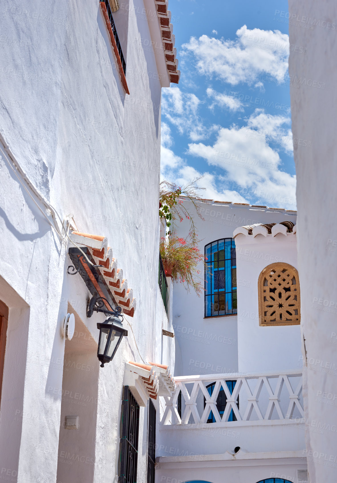 Buy stock photo Heritage, whitewash and balcony on house for architecture, buildings or travel in Spain. Andalusia, old city and village design with history for exploration, culture and stone in Europe for aesthetic