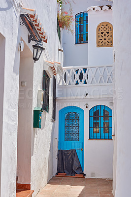 Buy stock photo Courtyard, whitewash and balcony on house for architecture, buildings or travel in Spain. Frigiliana, old city and village design with history for heritage, culture and stone in Europe for aesthetic