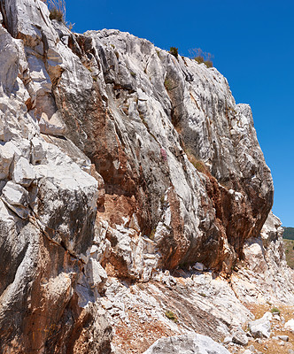 Buy stock photo Blue sky, mountain side or rock in nature for environment, land or travel in Spain. Ancient, old city or heritage in Ronda for habit creation, sustainability or landscape for destination or wallpaper