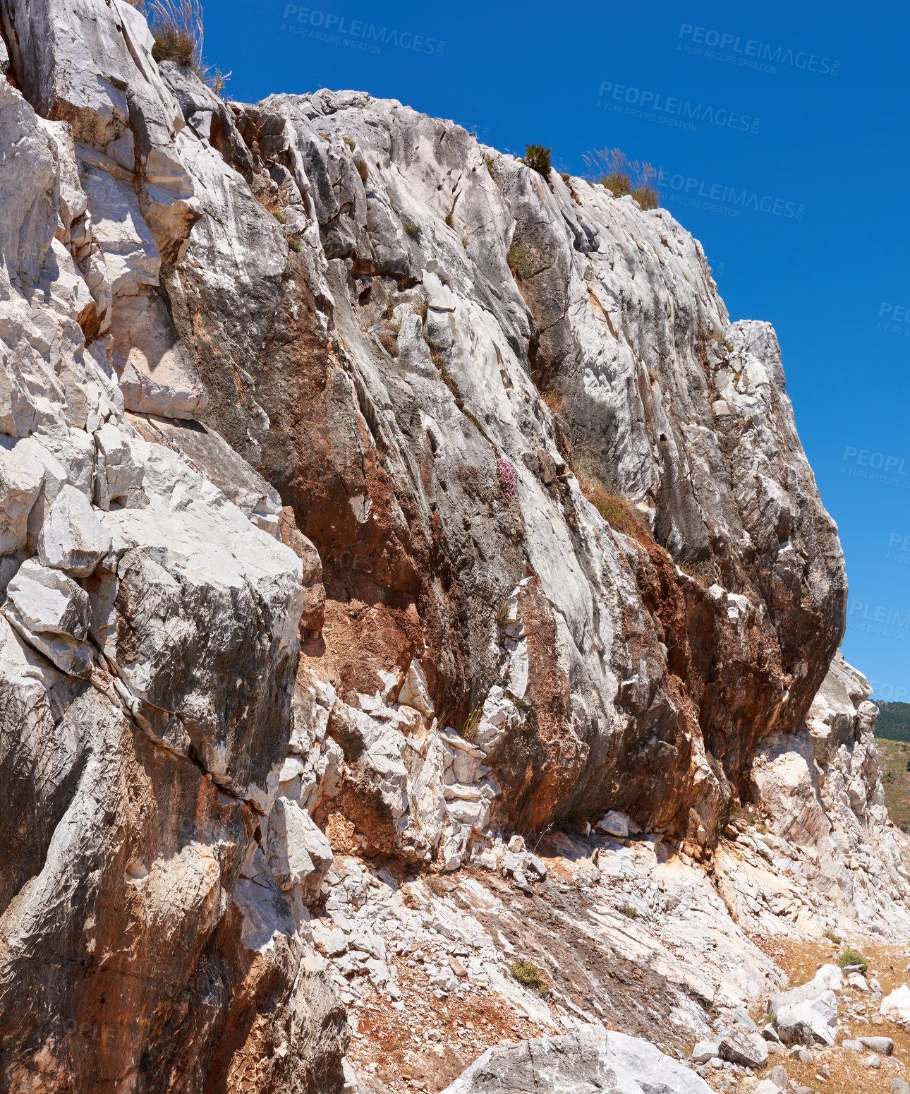 Buy stock photo Blue sky, mountain side or rock in nature for environment, land or travel in Spain. Ancient, old city or heritage in Ronda for habit creation, sustainability or landscape for destination or wallpaper