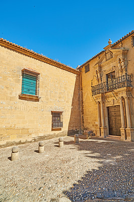 Buy stock photo Buildings, outdoor and ancient city with adventure, travel and Ronda with blue sky, Andalusia and Spain. Outside, empty and vacation with holiday, sunshine and journey with tourism and architecture