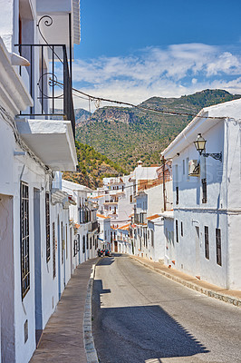 Buy stock photo Street, mountain and travel with old city, vacation and adventure with nature, Frigiliana and Andalusia. Spain, empty and buildings with architecture, outdoor and road with journey and summer holiday