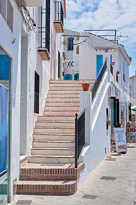 Buy stock photo Steps, town and outdoor architecture on vacation, Europe summer and historical culture on getaway. Stairs, city and traditional buildings in destination, tourism and urban holiday in Frigiliana