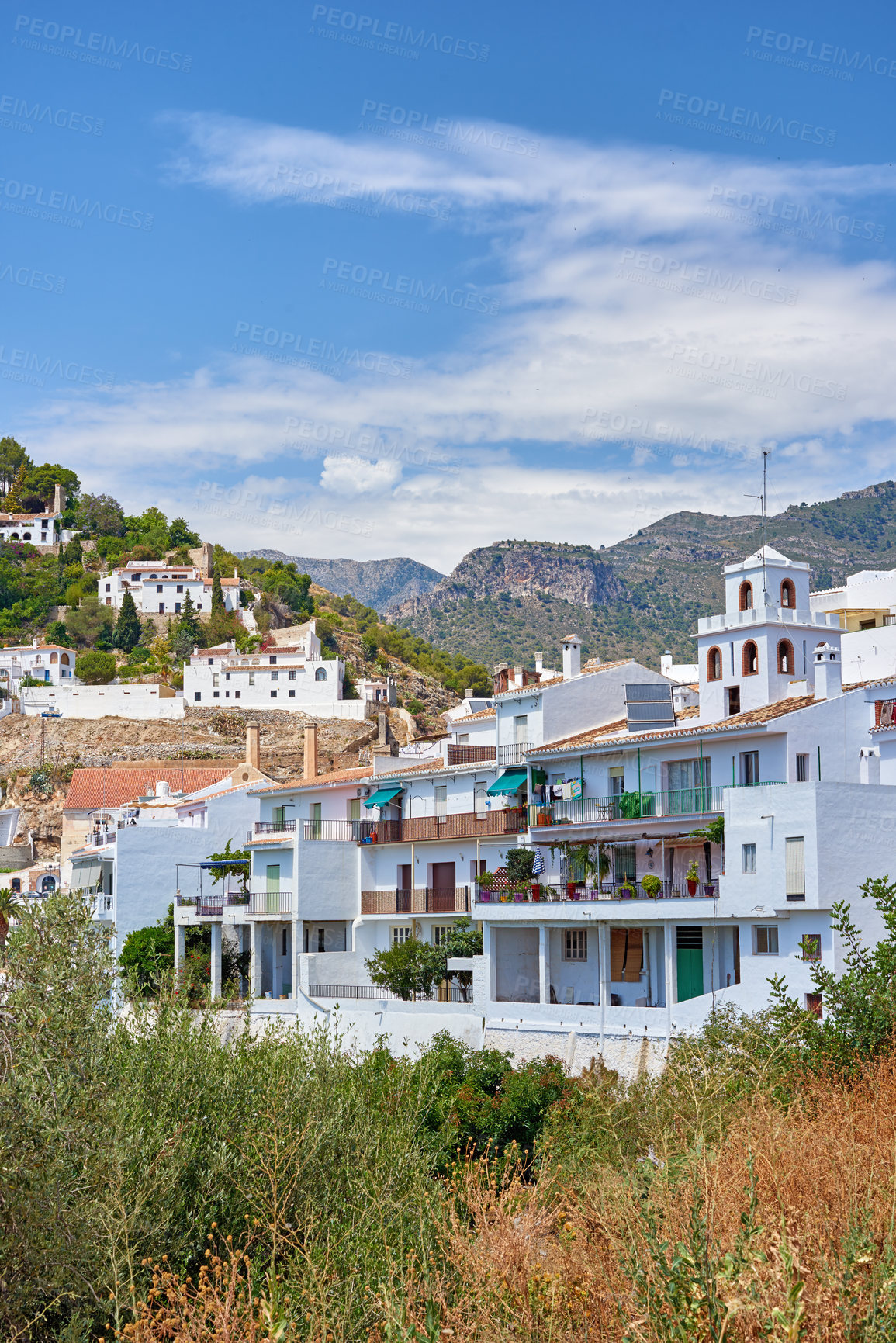 Buy stock photo Nature, buildings and holiday home in city for travel, destination or journey in Andalusia with vintage architecture. Location, blue sky and ancient house in village for vacation or getaway in Spain.