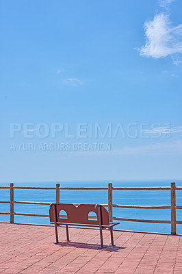 Buy stock photo Bench, ocean view and outdoor travel to sea, tourism and promenade in Malaga for peace or calm. Trip, beach vacation and blue sky mockup in environment, nature and balcony on holiday in Spain