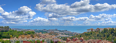 Buy stock photo Panoramic landscape, houses and architecture by ocean in nature for travel, vacation or holiday in Spain. Homes, sky and clouds with buildings in city, banner or tourism outdoor with trees in Malaga