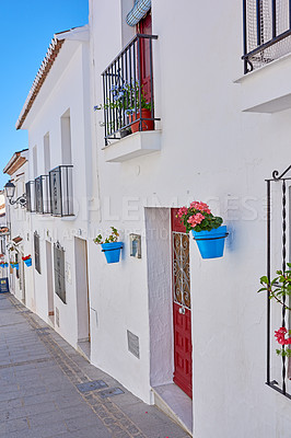 Buy stock photo Flower pot, wall and village with architecture, landscaping and travel as texture or wallpaper. Background, nature and home garden decor for tourism, outdoor adventure or holiday destination in Spain