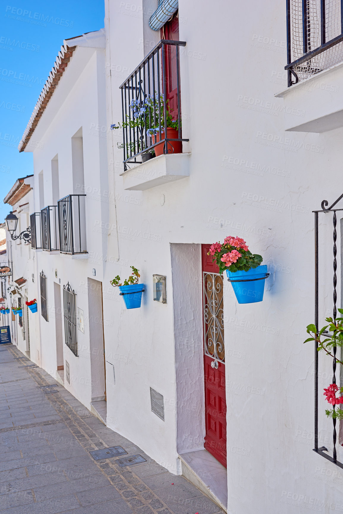 Buy stock photo Flower pot, wall and village with architecture, landscaping and travel as texture or wallpaper. Background, nature and home garden decor for tourism, outdoor adventure or holiday destination in Spain