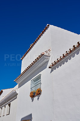 Buy stock photo Ancient, building and wall architecture of blue sky for village travel, history tourism and vintage location. Urban, real estate and structure of traditional culture, holiday and destination in Spain