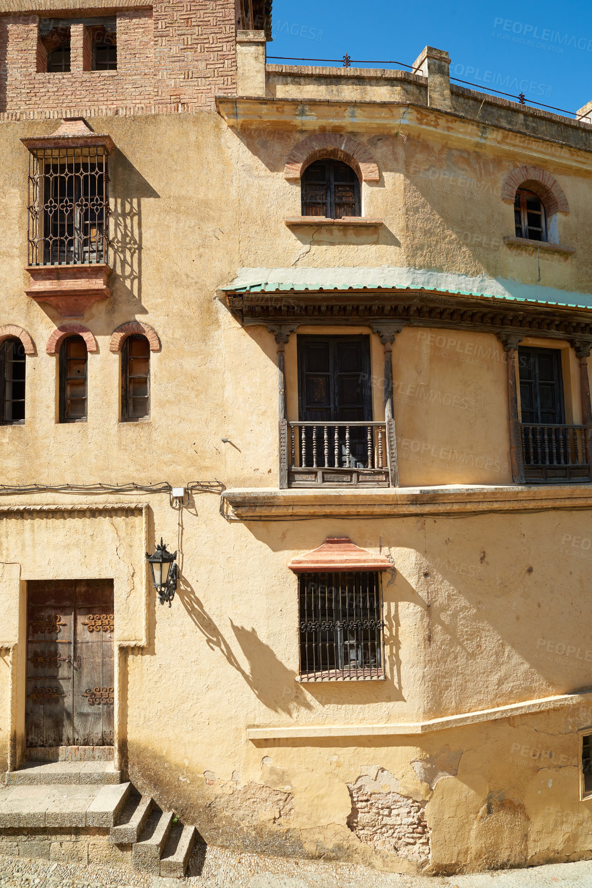 Buy stock photo Steps, building and outdoor architecture on vacation, Europe summer and historical culture on getaway. Stairs, city and traditional neighborhood for tourism, destination and urban holiday in Ronda