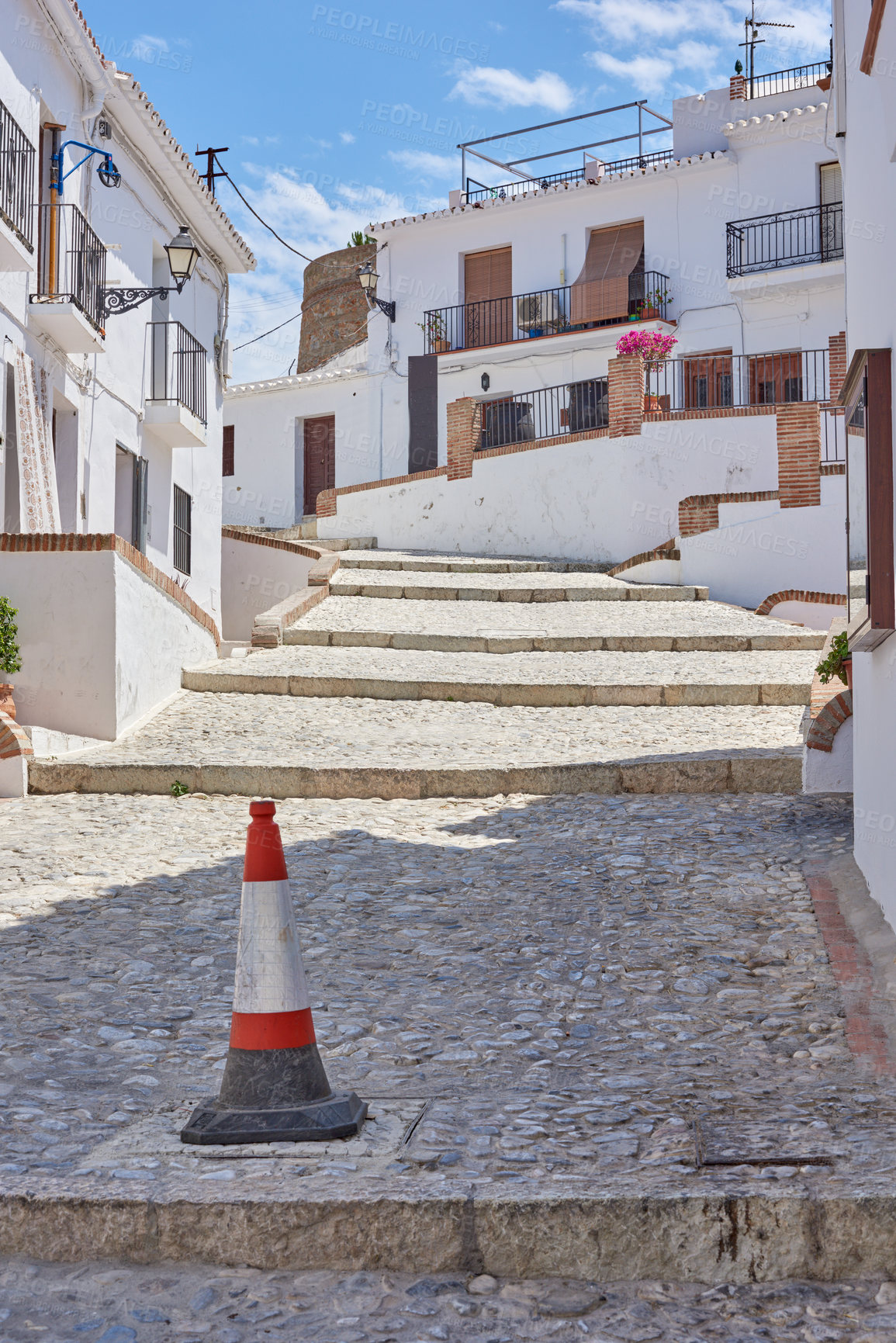 Buy stock photo Town, cobblestone and outdoor for weekend trip, Europe summer and street for peace in Frigiliana. Buildings, architecture and culture in Spain for tourism, holiday and calm environment on vacation