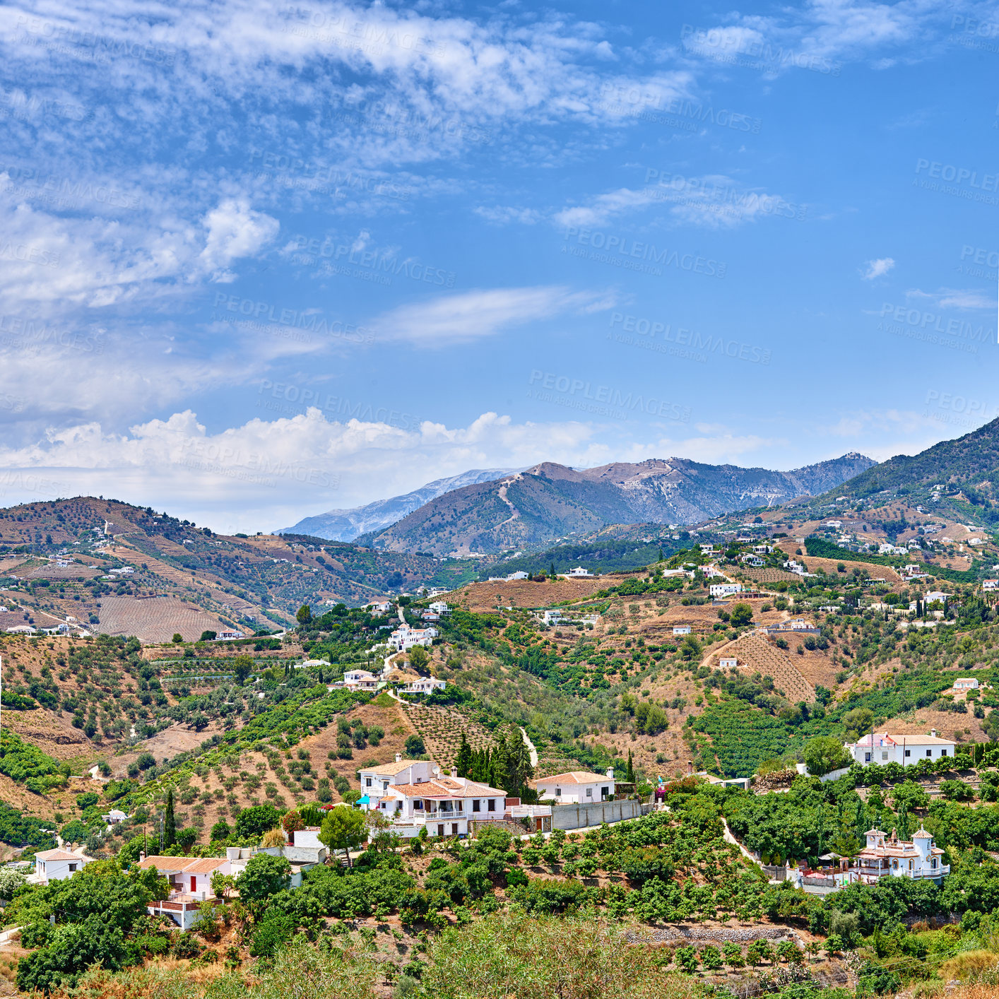 Buy stock photo Blue sky, buildings and town for travel, destination or holiday in Andalusia with vintage architecture. Location, nature and ancient houses outdoor in village for vacation, getaway or trip in Spain.