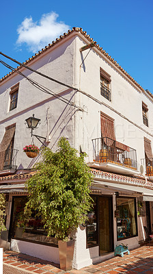 Buy stock photo Flower pot, wall and travel with architecture, building and neighborhood as texture or wallpaper. Background, town and home garden decor for tourism, outdoor adventure or holiday destination in Spain