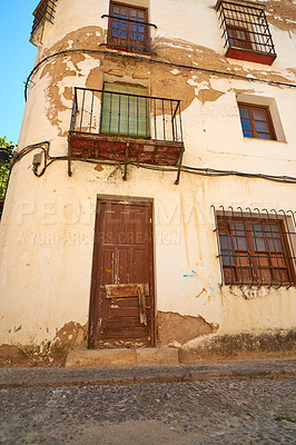 Buy stock photo Building, ancient and outdoor architecture on vacation, Europe summer and historical culture on getaway. Travel, vintage and traditional village in destination, tourism and urban holiday in Ronda