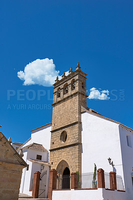 Buy stock photo Church, town and outdoor architecture on vacation, Europe summer and historical culture on getaway. Landmark, Spain city and traditional buildings in destination, tourism and urban holiday in Ronda