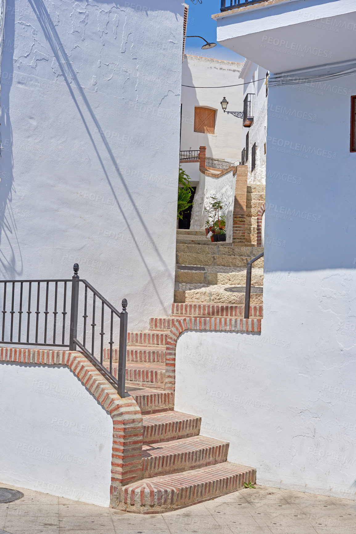 Buy stock photo Town, outdoor or houses by steps in neighborhood with traditional architecture in Spain. Outside, stairs or village with cultural or vintage style design for holiday, vacation or tourism destination