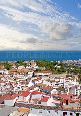 Buy stock photo Outdoor, buildings and village in nature, roof and architecture of homes, above and neighbourhood. Cliff, mockup space and sky of countryside, property and history of real estate, scenery and Spain