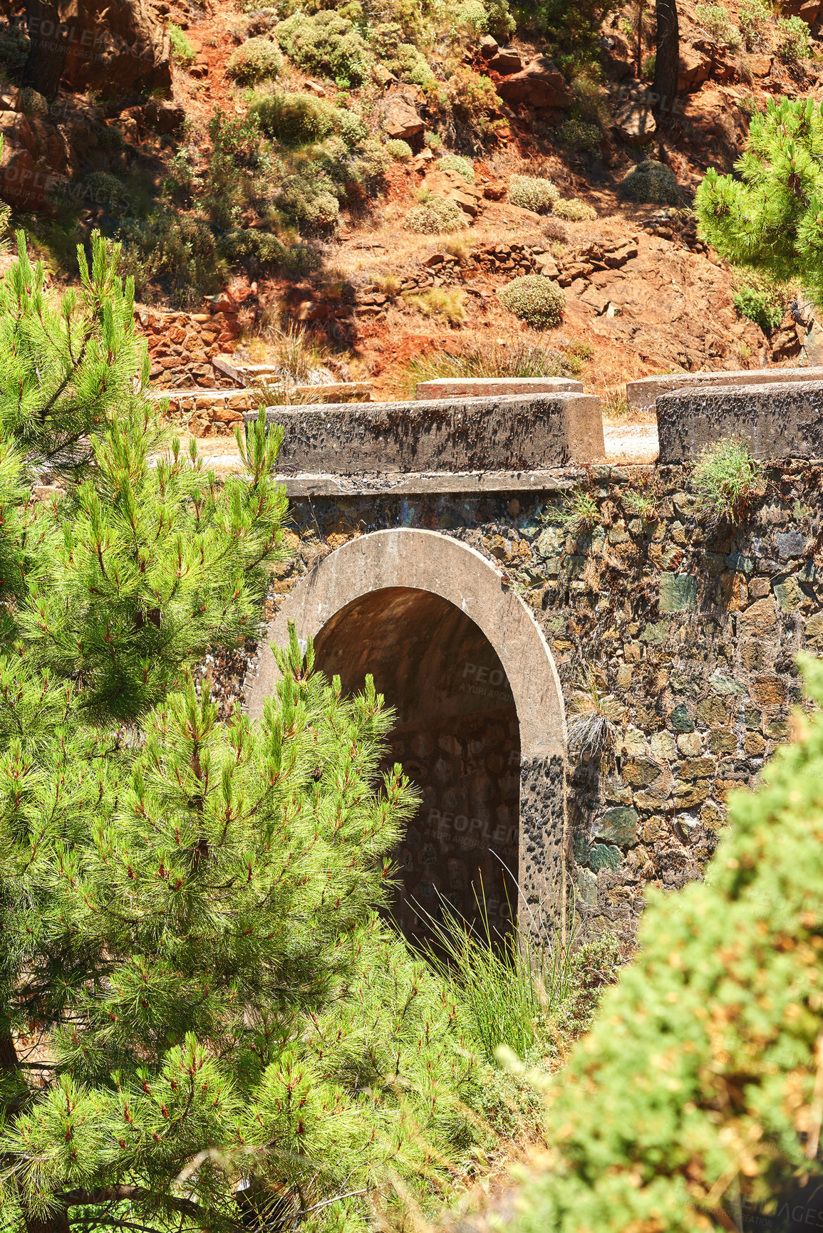 Buy stock photo Ancient, bridge and architecture of design outdoor for wall structure, mountain travel and history location. Cobblestone, nature or stone texture for tunnel, construction and vintage pathway of Spain