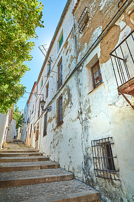 Buy stock photo Vintage street, travel and alley with holiday destination, texture and background in town or city. Wallpaper, outdoor and cobblestone in neighborhood for tourism, adventure or sightseeing for journey