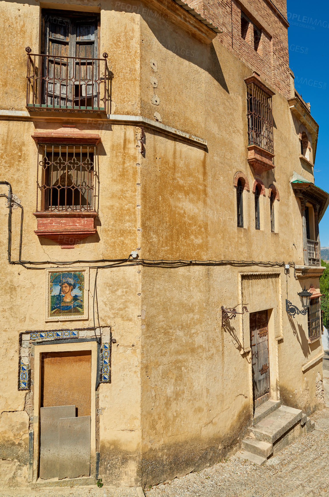 Buy stock photo Ancient, buildings and house architecture in city with wall structure, travel location and history tourism. Abandoned, property or window view, balcony fence and vintage neighborhood of Spain holiday