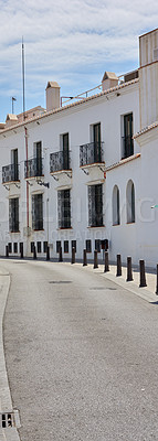 Buy stock photo Outdoor, houses and road in town with traditional architecture in neighborhood of Italy. Outside, street and village with cultural or vintage design as holiday or vacation destination for tourism