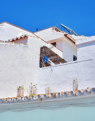 Buy stock photo Ancient, city and house building for architecture with windows, wall structure and travel location of tourism. Vintage, property and fence, balcony view and blue sky history culture of Spain holiday