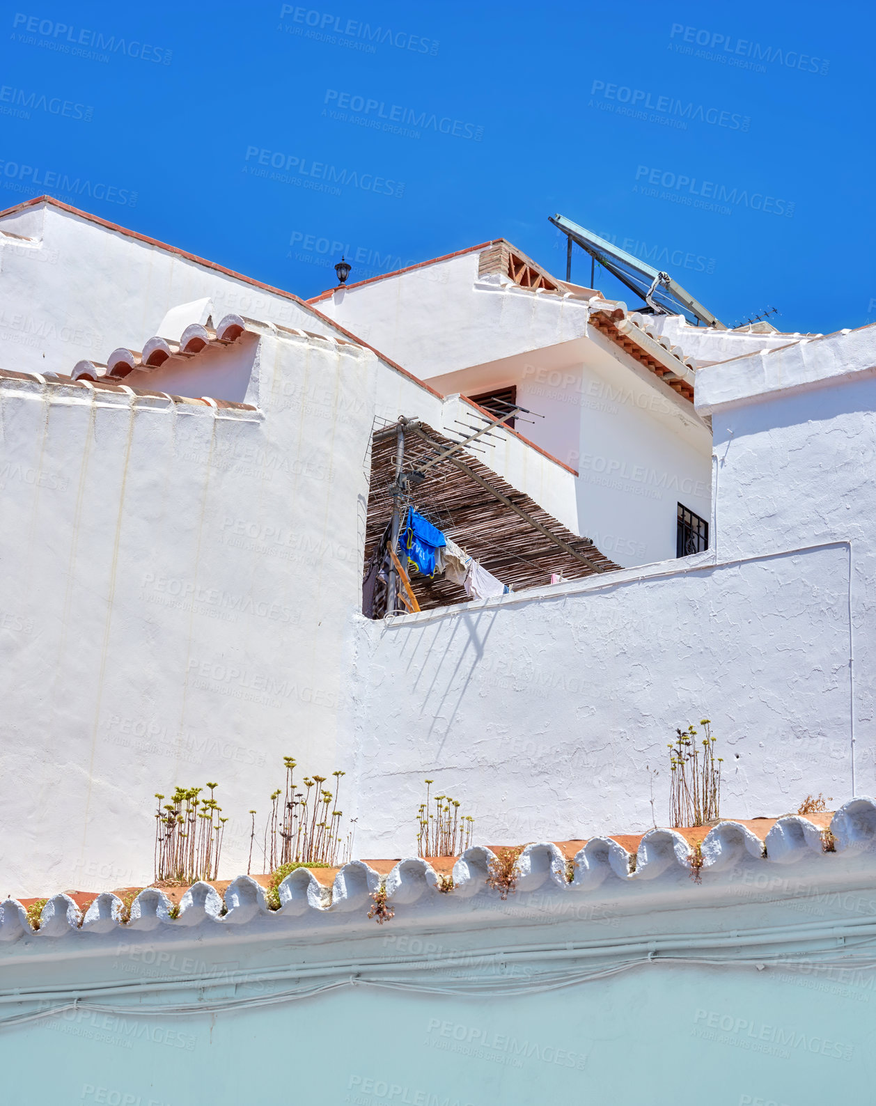 Buy stock photo Ancient, city and house building for architecture with windows, wall structure and travel location of tourism. Vintage, property and fence, balcony view and blue sky history culture of Spain holiday