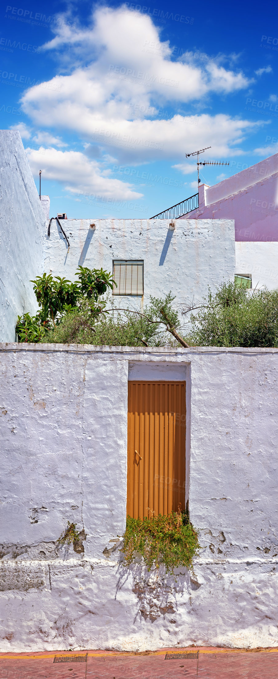 Buy stock photo Ancient, buildings and architecture house in city with windows, wall structure and travel location of tourism. Vintage, property and plants, balcony view and blue sky history culture of Spain holiday