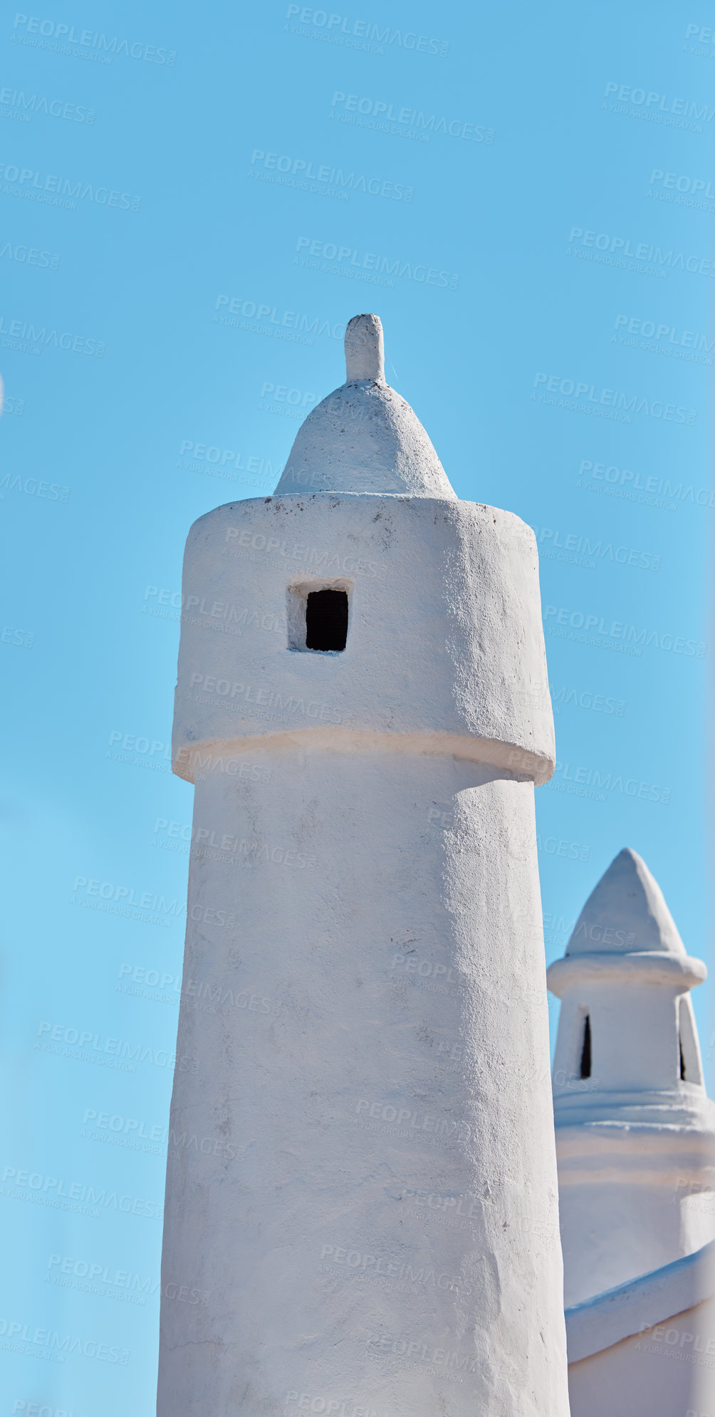 Buy stock photo Chimney, stone and architecture in village for ventilation, buildings and city design for wallpaper in Spain. Colahonda, whitewashed structure and sky background on coast for heritage or aesthetic