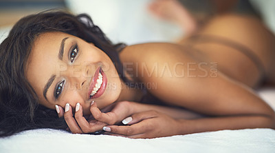 Buy stock photo Shot of a gorgeous young woman posing seductively in her bedroom