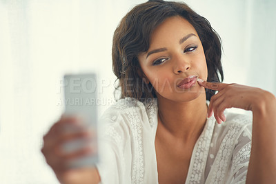 Buy stock photo Shot of a gorgeous young woman posing seductively for a selfie in her bedroom