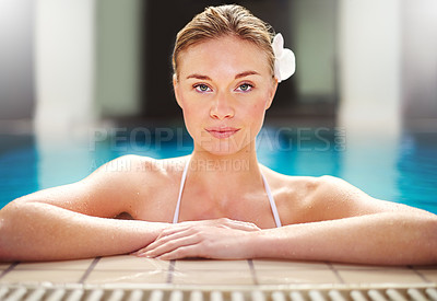 Buy stock photo Shot of a young woman relaxing in the pool at a spa