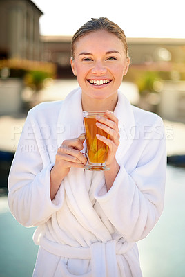 Buy stock photo Portrait of an attractive young woman enjoying a drink at a spa