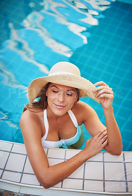 Buy stock photo Shot of a young woman relaxing at a spa pool