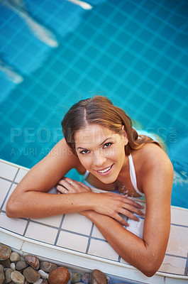 Buy stock photo Above, swimming pool and portrait of woman in spa for holiday, vacation and hospitality on weekend. Luxury resort, swimmer and person in water in bikini or swimsuit for wellness, relaxing and health