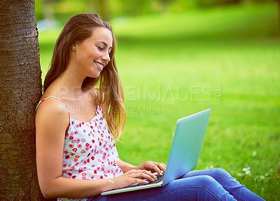 Buy stock photo Relax, happy and woman in park on laptop for online learning, internet and university website. College, higher education and person on computer for social networking, research and working outdoors