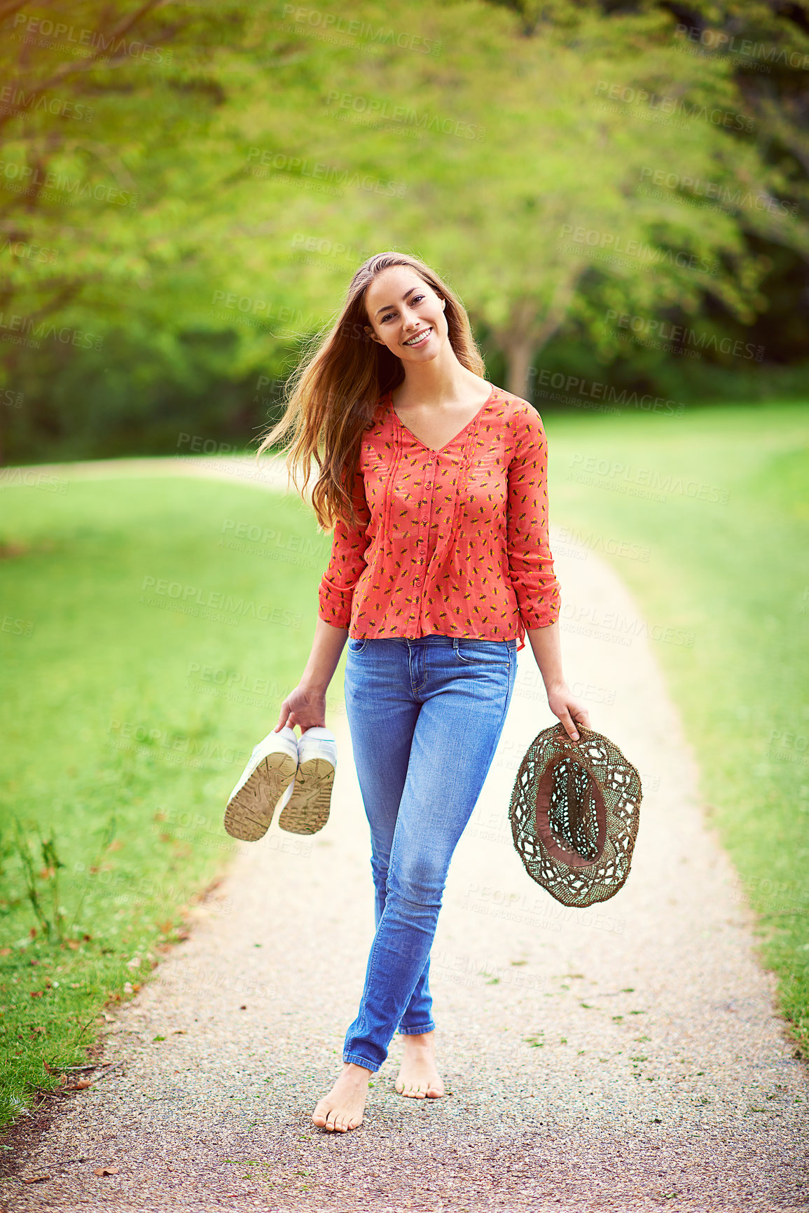 Buy stock photo Smile, woman and portrait or grass on path for adventure, freedom and holiday in nature. Happy, female person and vacation or trees, environment and countryside for journey in garden for wellness