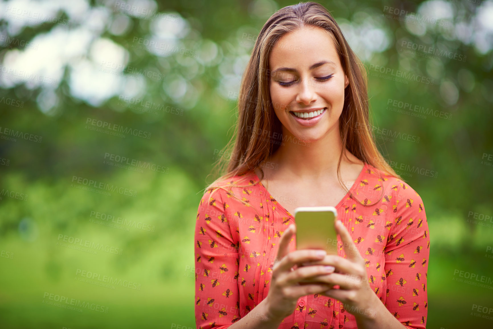 Buy stock photo Smartphone, woman and smile in nature for notification, social media and online app in park. Happy, internet and college student with technology for networking, typing and website for blog or contact