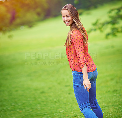 Buy stock photo Shot of a young woman enjoying a day in the outdoors