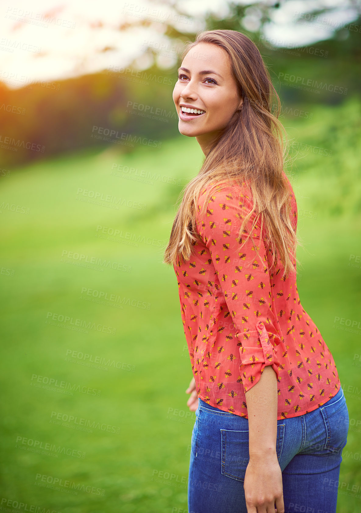 Buy stock photo Shot of a young woman enjoying a day in the outdoors