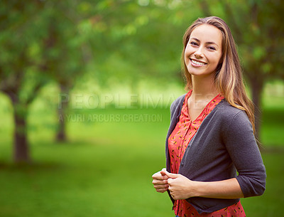 Buy stock photo Portrait of a young woman standing in the outdoors