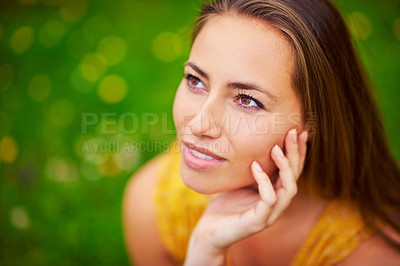 Buy stock photo Cropped shot of a thoughtful young woman at the park