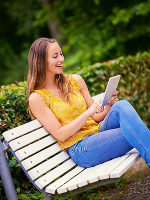 Buy stock photo Laugh, woman and tablet outdoor for reading, research and networking for school project. College student, comedy and technology on bench in garden for social media, communication and meme or video